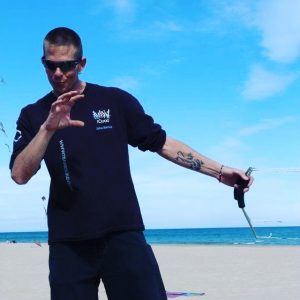 John Barresi flying quad line kite handles on the beach